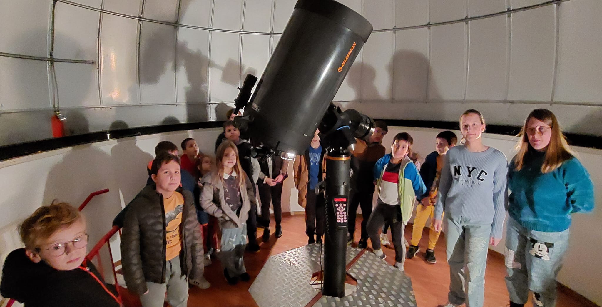 Kids around telescope